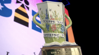 The championship trophy is on stage in Florida, ready to be handed to a new champion of the Scripps National Spelling Bee.