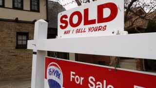 Sale sign outside Denver home