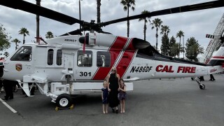 Ashley Iverson in front of chopper