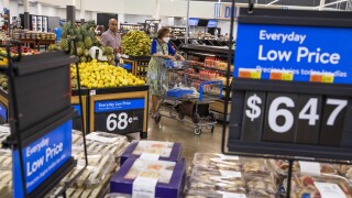 People buy groceries at a Walmart Superstore