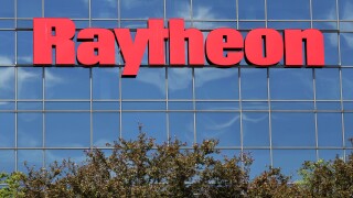 The sky is reflected on the facade of Raytheon's Integrated Defense Systems facility